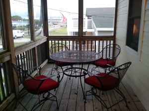 Screen porch sitting at the beach house.