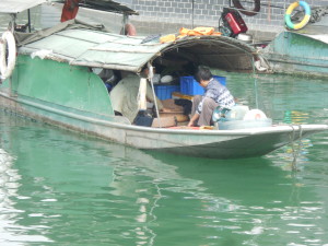 Chinese family living on their fishing boat