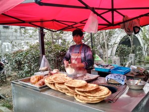 Getting the stink-eye from the flat bread vendor.