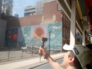 Crazy Italian tourist who spent the entire tour taking selfies on the bus while missing things like this great wall mural.