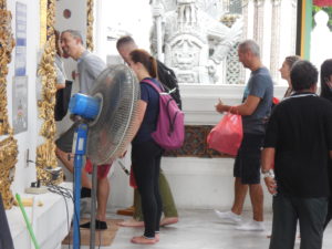 Shoes in hand you line up to enter the temple.