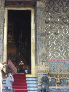 Workmen preparing for the ceremony in front of the temple. E.B. is the gold thing in the back.