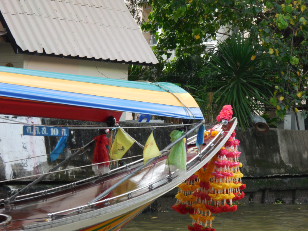 Flower offerings on the front of a longtail boat for a safe passage. They smell amazing. (Jasmine)